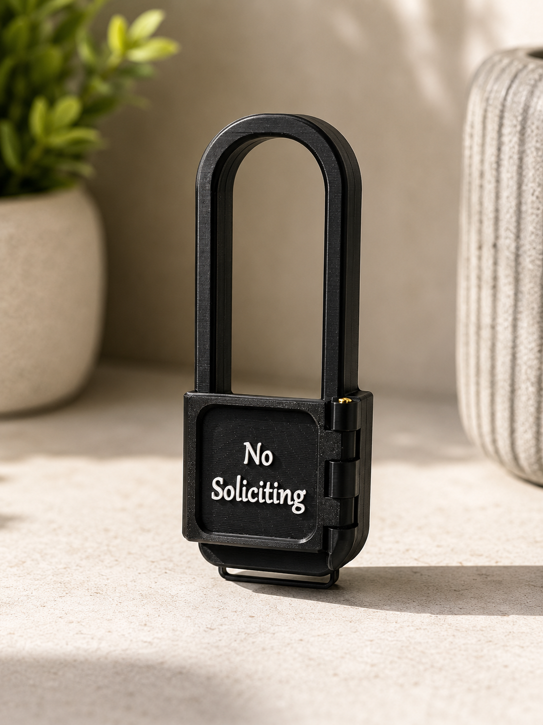 AvrenForge No Soliciting cover styled on a counter with greenery